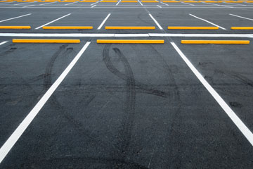 Parking Lot Wheel Stop with Yellow Stripes